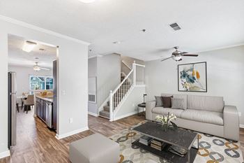 One K Apartments in Atlanta, GA photo of a living room with a couch and a table